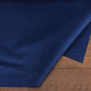 Luxurious velvet bridesmaid dresses in rich hues like navy blue and deep emerald, showcasing elegance and warmth for a Thanksgiving wedding.